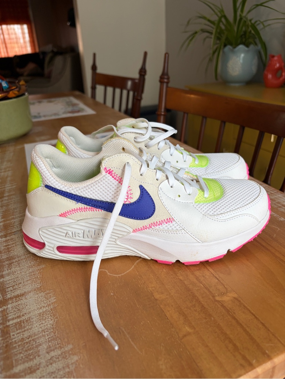 Nike White Athletic Shoes with Blue Swoosh and Neon Accents